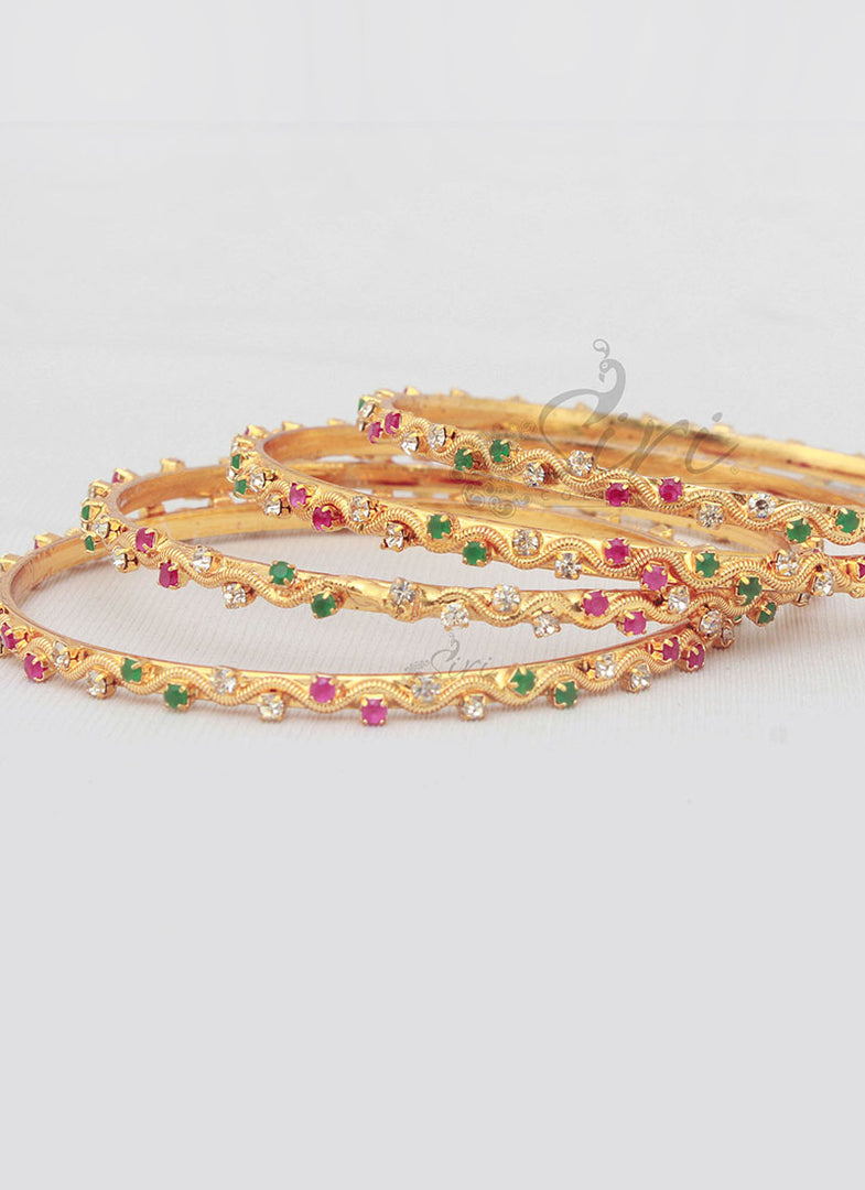 Designer Set of Four Bangles in Gold Micro Polish