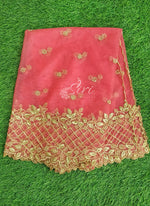 A pink net cut work dupatta with golden embellishments