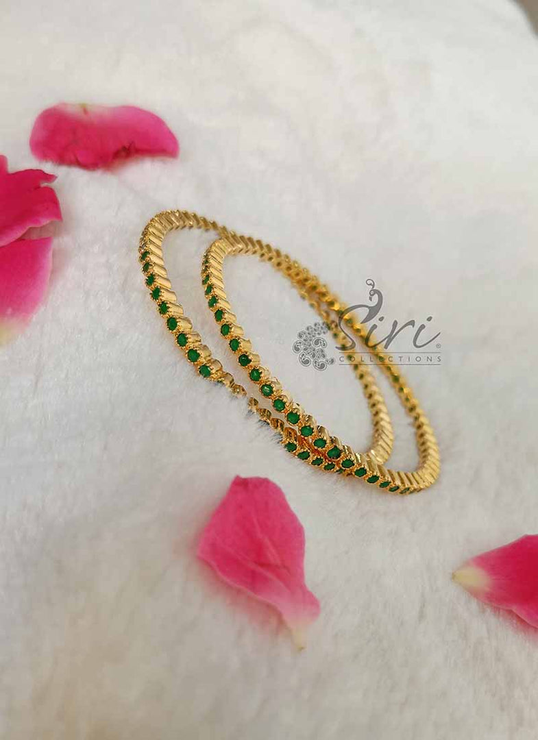 Beautiful Pair of Bangles in Small Emeralds